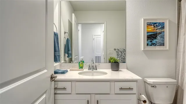 a dining room with furniture a window and wooden floor