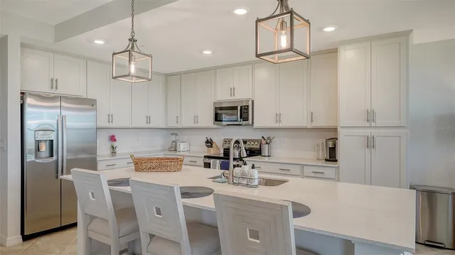 a view of a dining table and chairs