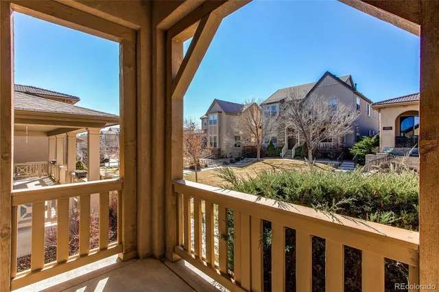 a view of a houses from a balcony