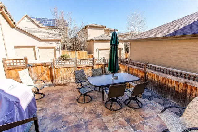 a view of a chairs and table in the patio