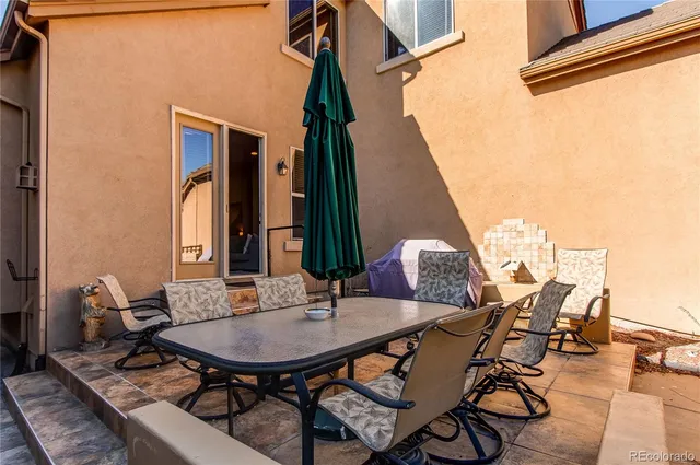 a view of a tables and chairs in patio