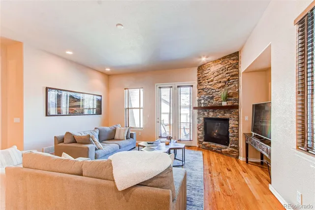 a living room with furniture fireplace and flat screen tv