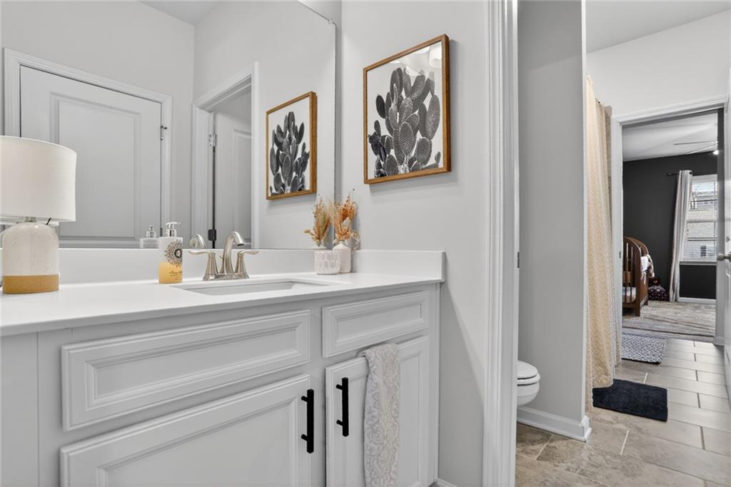 454 Carmichael Circle Canton, GA 30115 - Photo 24 of 30 a bathroom with a sink and a mirror