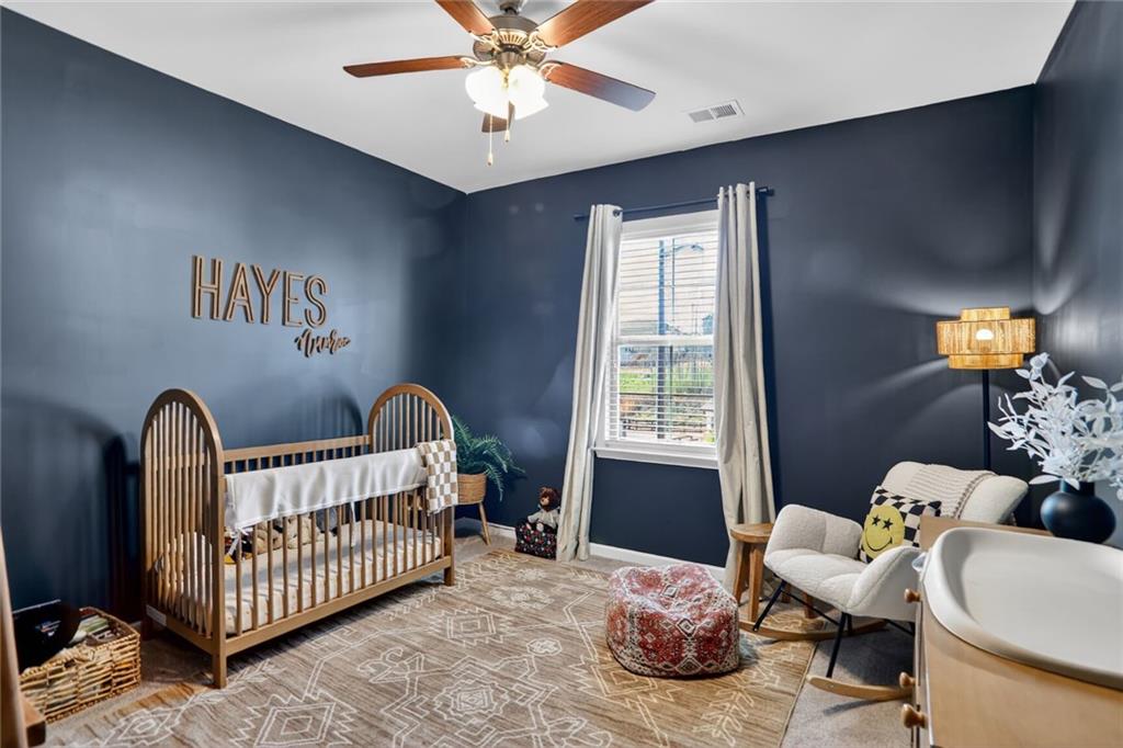 454 Carmichael Circle Canton, GA 30115 - Photo 25 of 30 a bedroom with furniture and windows