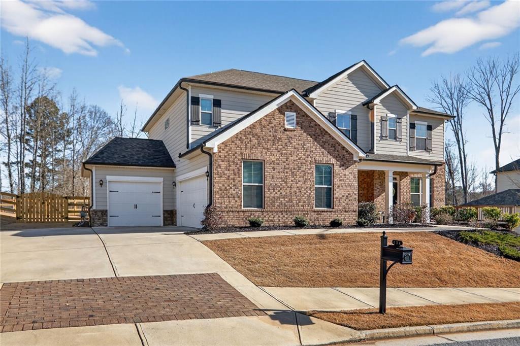 454 Carmichael Circle Canton, GA 30115 - Photo 3 of 30 a front view of a house with garage