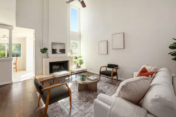 a living room with furniture and a fireplace