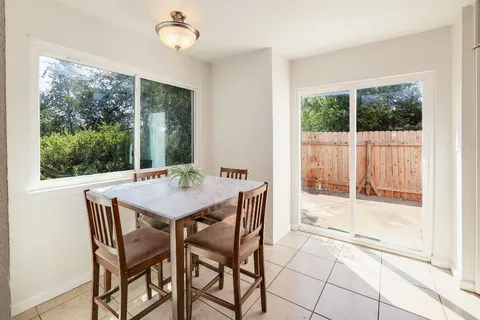 a dining room with a window and a table