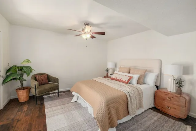 a bedroom with a bed and a couch