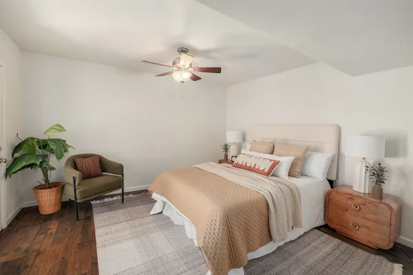 a bedroom with a bed and a couch