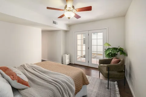 a bedroom with a bed and a couch