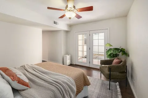 a bedroom with a bed and a couch