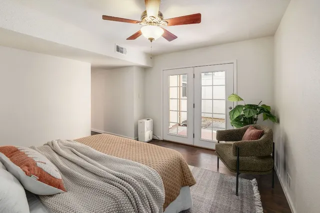 a bedroom with a bed and a couch