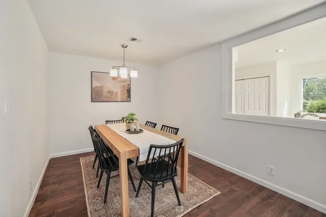 a view of a dining room with furniture window and wooden floor
