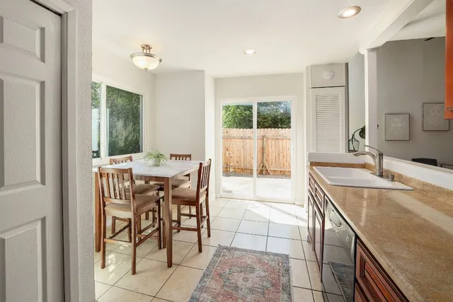 a view of a dining room and a table and chairs