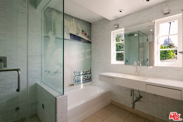 a bathroom with a bathtub and a sink