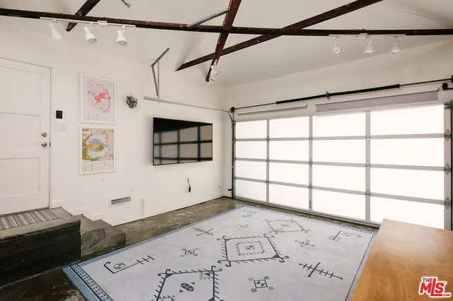 a view of a backyard with sitting area