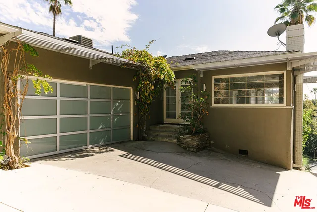 a view of a chairs and table in patio