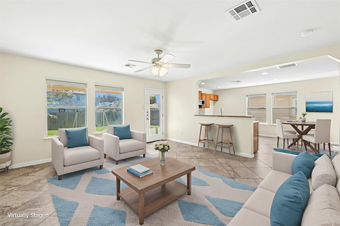 17913 Honey Locust Lane Elgin, TX 78621 - Photo 11 of 31 a living room with furniture and a table
