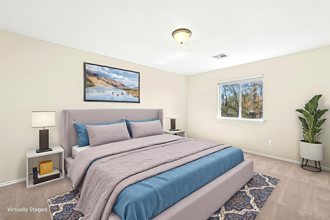 17913 Honey Locust Lane Elgin, TX 78621 - Photo 16 of 31 a bedroom with a bed and a couch