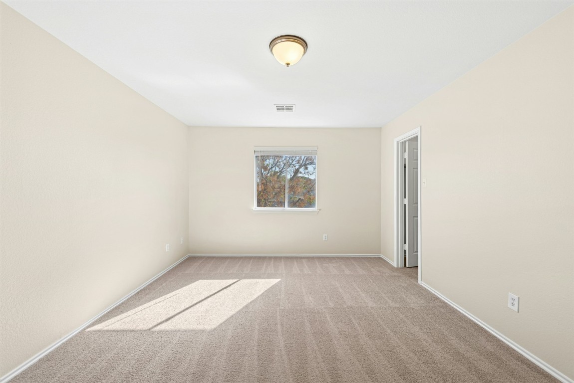 17913 Honey Locust Lane Elgin, TX 78621 - Photo 17 of 31 a view of a hallway with a window