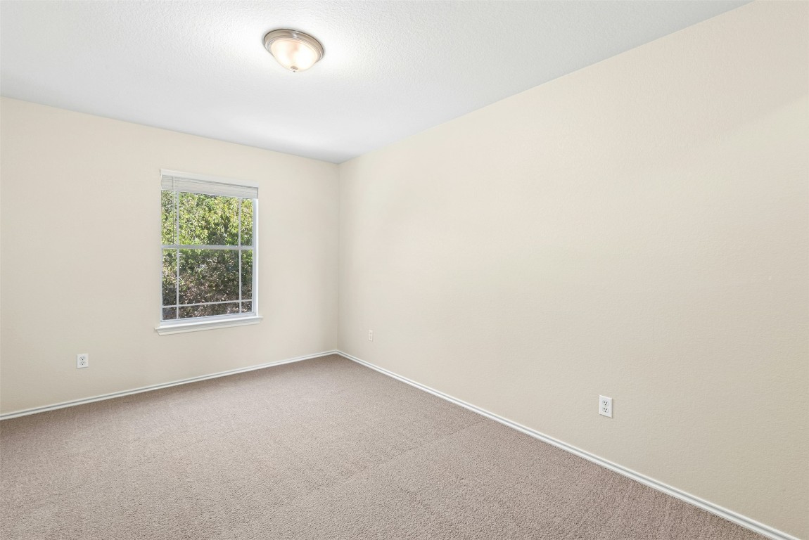17913 Honey Locust Lane Elgin, TX 78621 - Photo 24 of 31 an empty room with a window