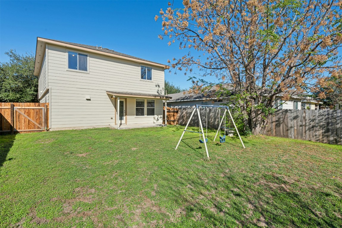 17913 Honey Locust Lane Elgin, TX 78621 - Photo 31 of 31 a view of a house with a backyard