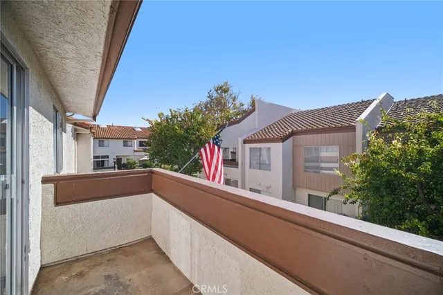 a bedroom with a bed and a lamp