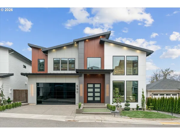 a front view of a house with a yard