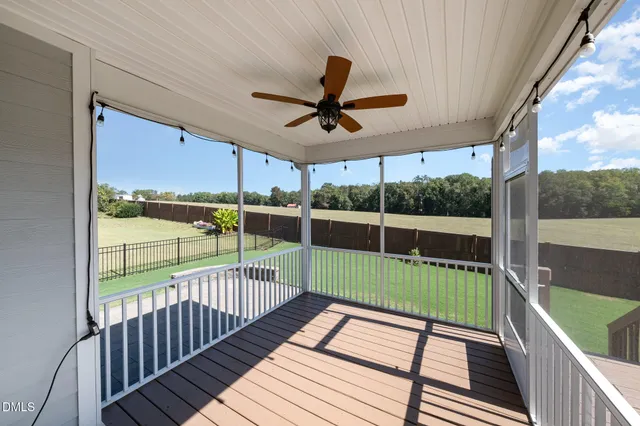 a view of a balcony with wooden floor