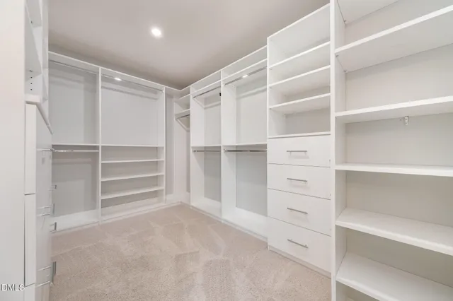 a view of an empty walk in closet