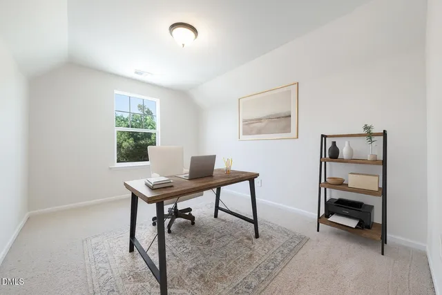 a view of a workspace with furniture