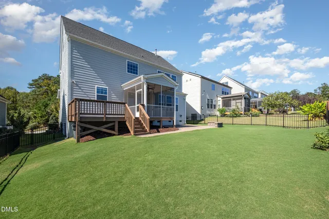 a view of a house with backyard porch and sitting area