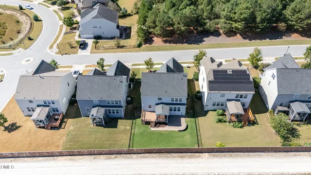 an aerial view of a house with a swimming pool