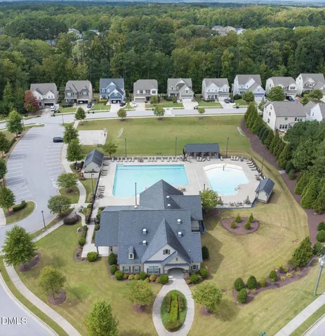 an aerial view of a house with outdoor space