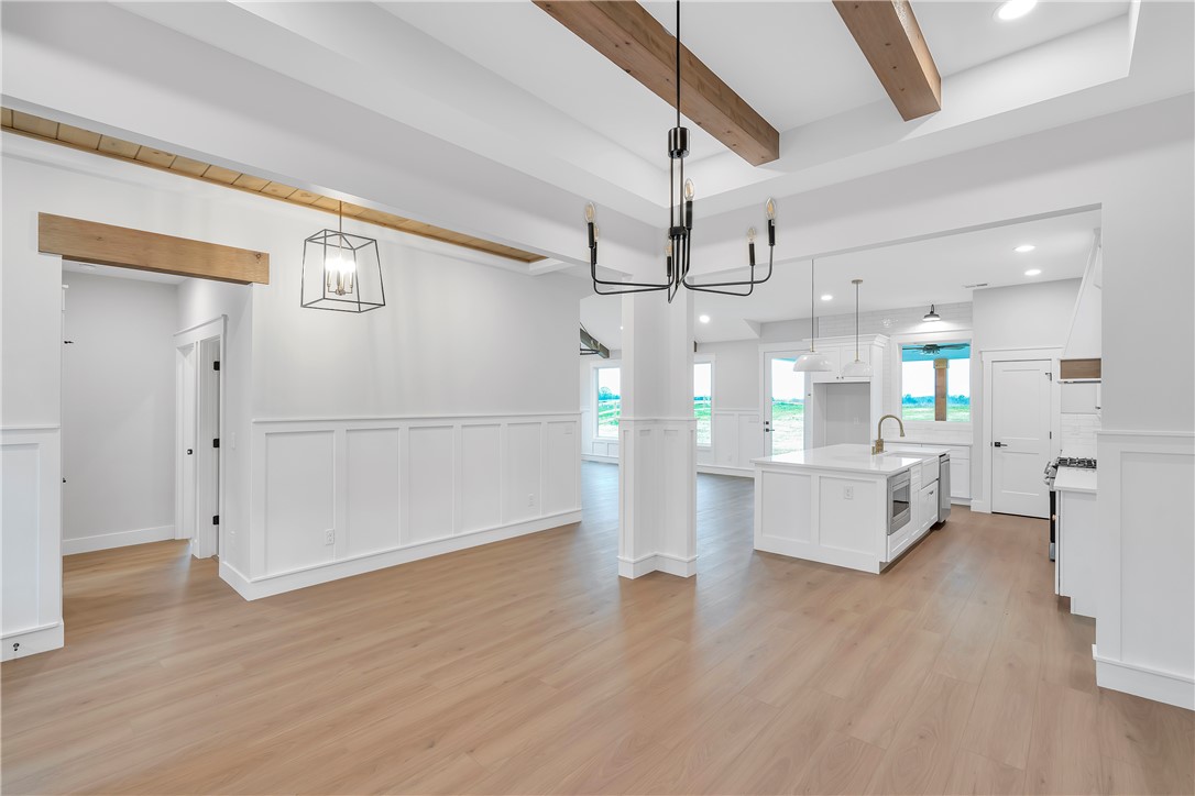 4554 Flat Rock Road Iva, SC 29655 - Photo 16 of 32 Exposed wood beams add architectural interest to this bright, open-concept living space.