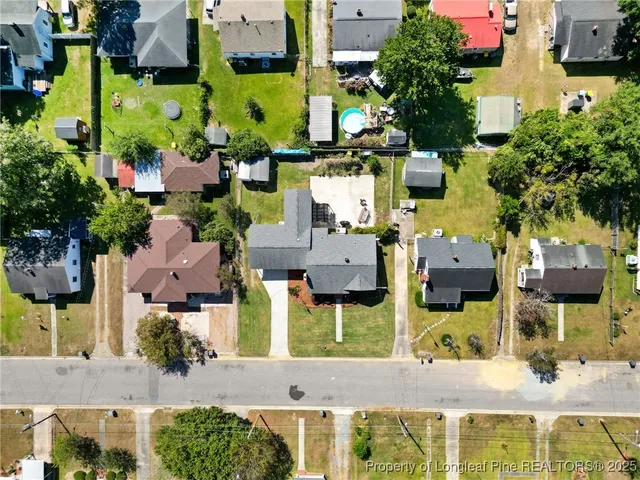 an aerial view of houses with yard