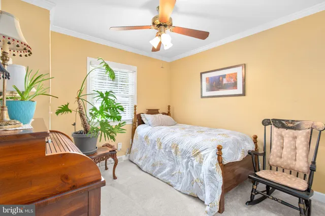 a bedroom with a bed and chair