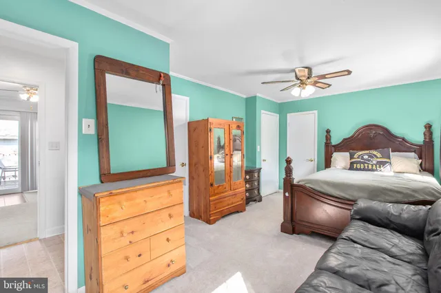 a bedroom with a bed and a dresser