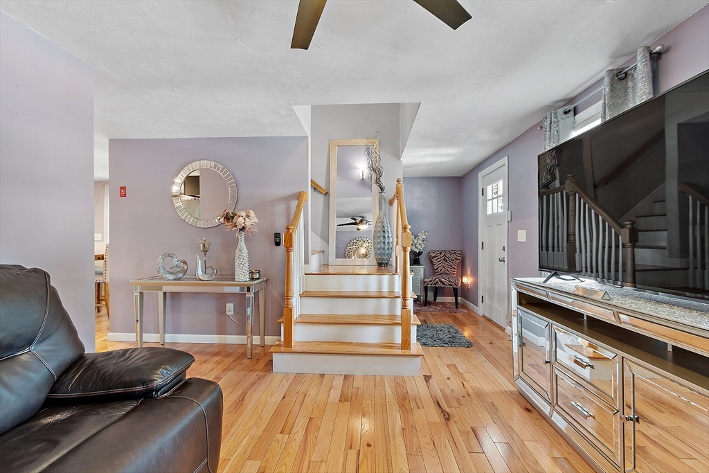 506 Pleasant Street Gardner, MA 01440 - Photo 15 of 41 a living room with furniture and a wooden floor