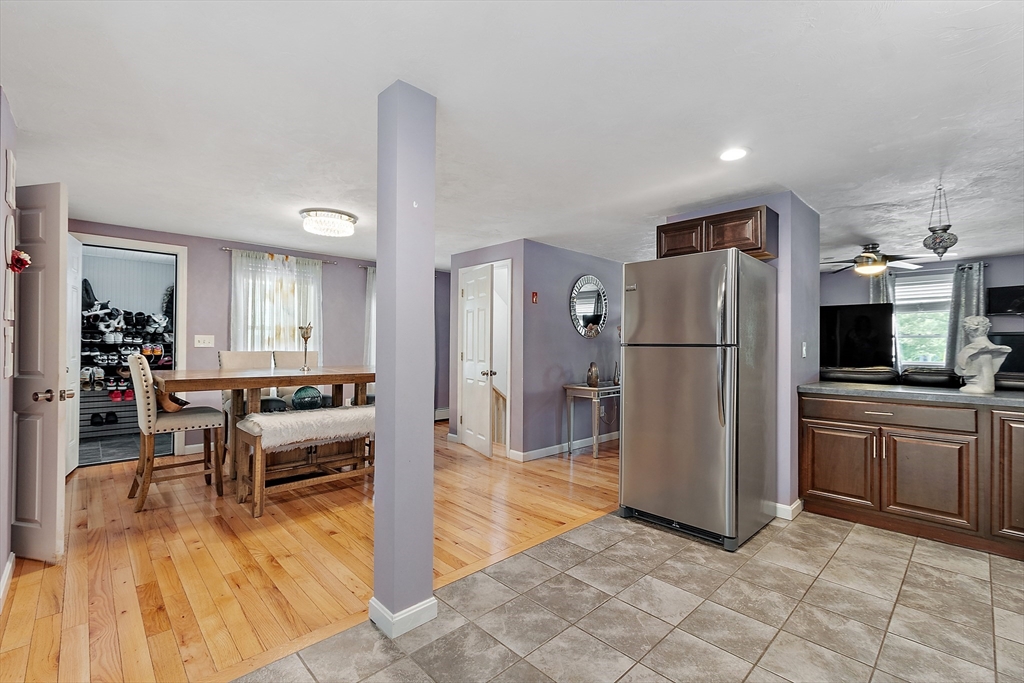 506 Pleasant Street Gardner, MA 01440 - Photo 25 of 41 a kitchen with stainless steel appliances a refrigerator and a stove top oven