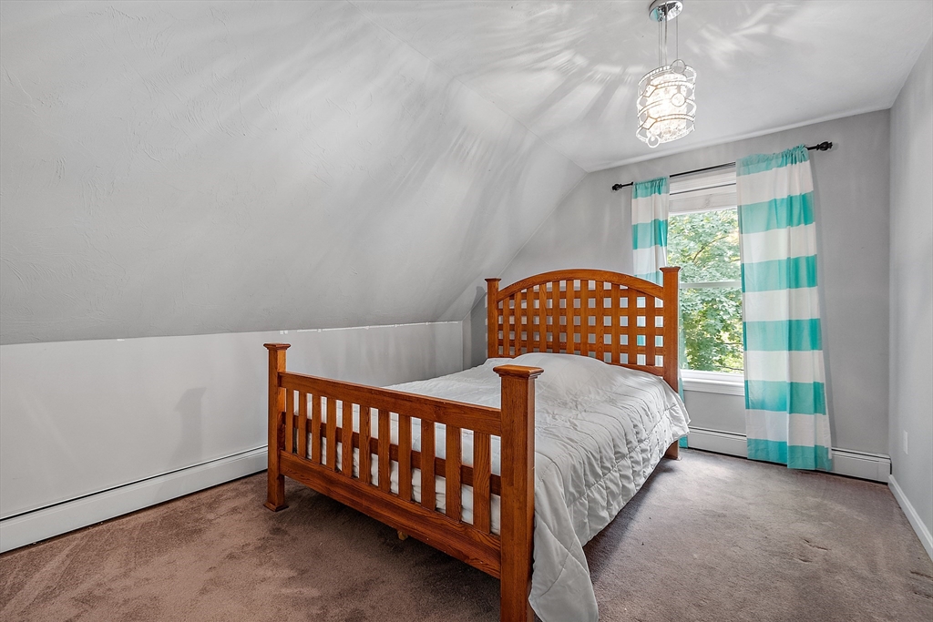 506 Pleasant Street Gardner, MA 01440 - Photo 30 of 41 a bedroom with a bed and a window