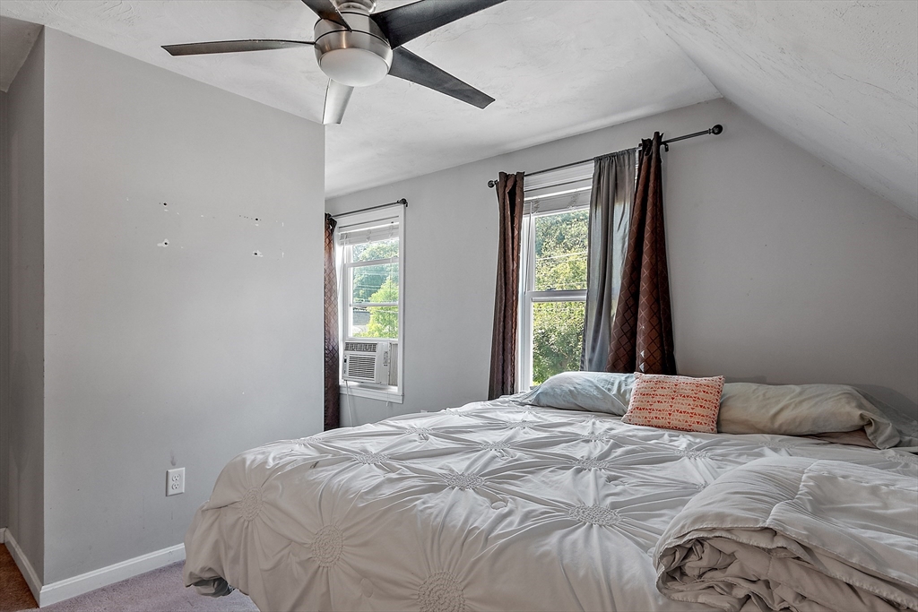 506 Pleasant Street Gardner, MA 01440 - Photo 34 of 41 a bedroom with a bed and a window