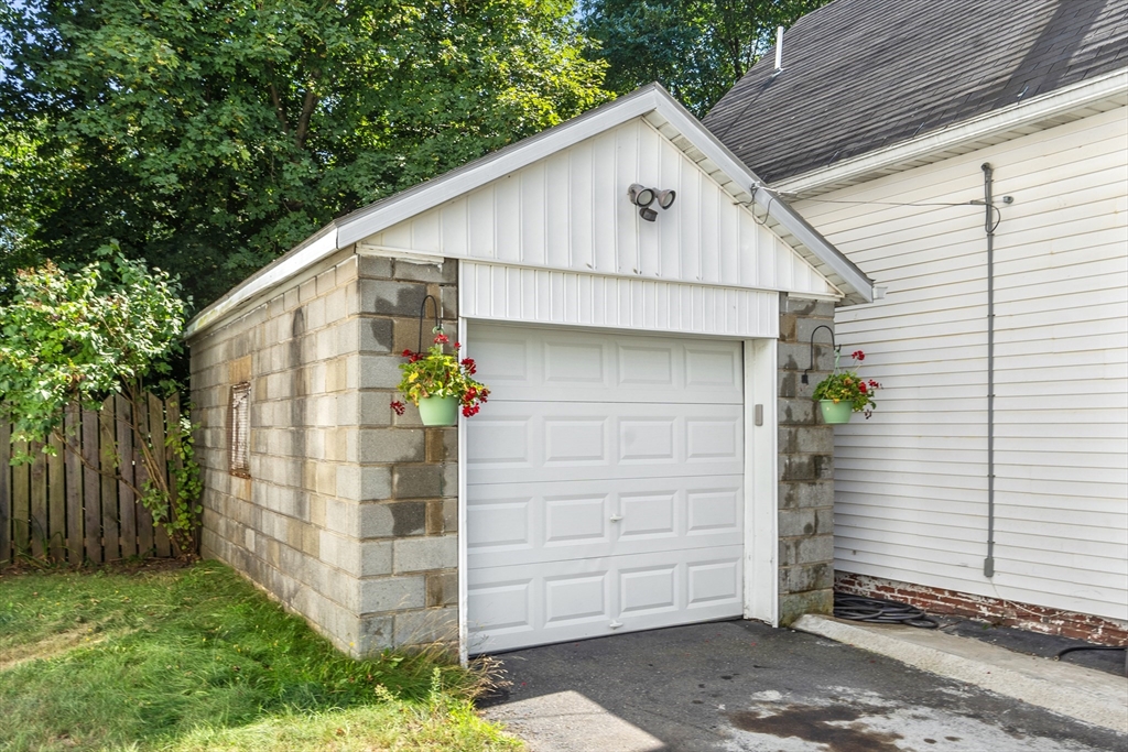 506 Pleasant Street Gardner, MA 01440 - Photo 8 of 41 a view of a small house with a yard