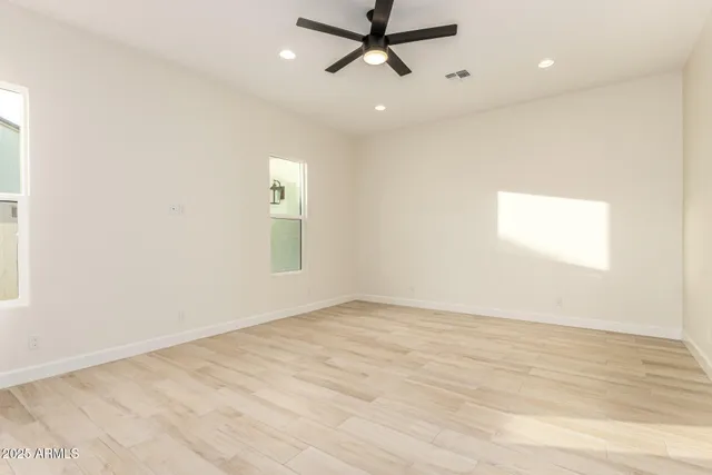 a bathroom with a double vanity sink a mirror and a bathtub