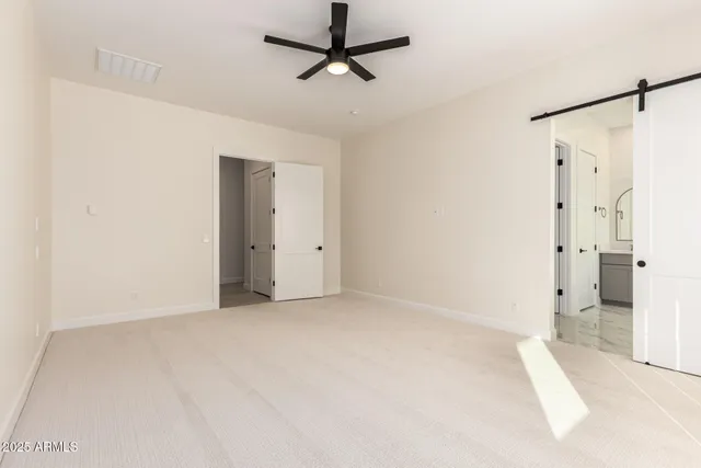 a living room with a large window and a table