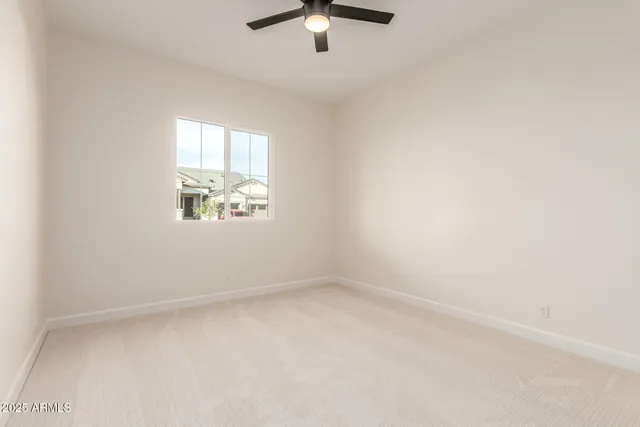 a bathroom with a toilet sink vanity and mirror