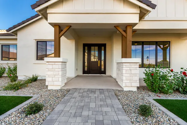 a view of a kitchen with a sink and a fireplace
