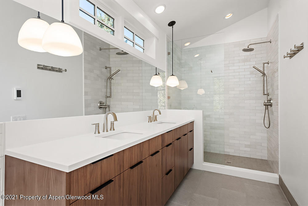 334 Sopris Circle Basalt, CO 81621 - Photo 12 of 34 a bathroom with a double vanity sink mirror and shower