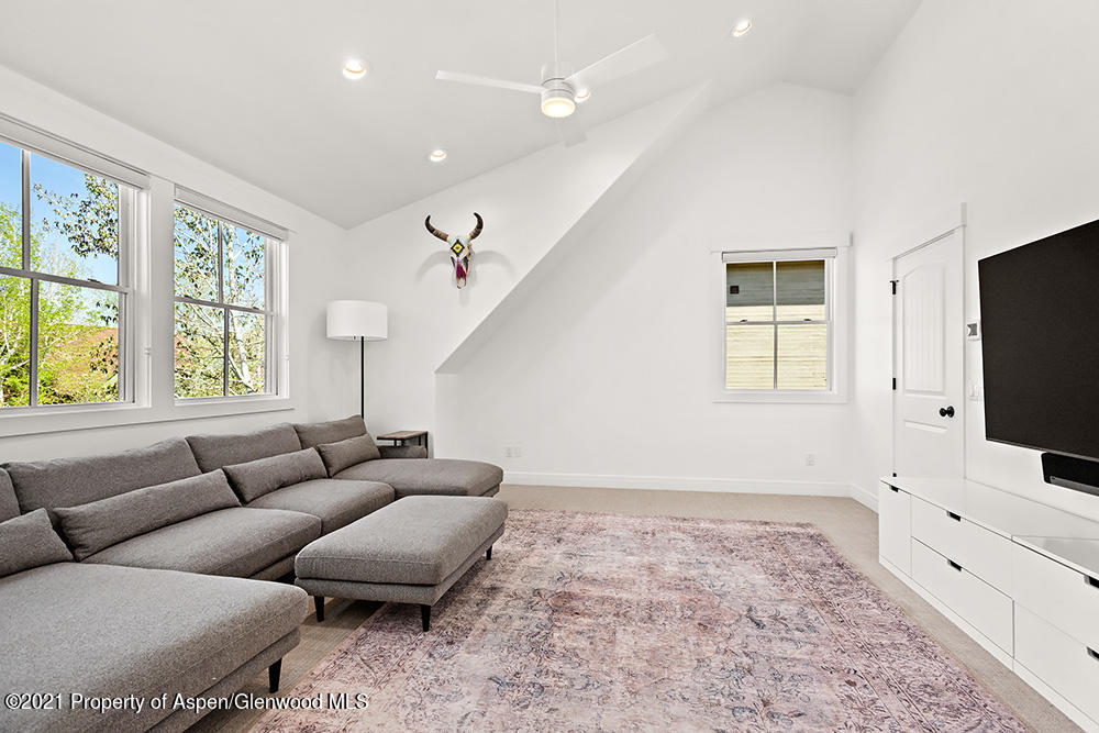 334 Sopris Circle Basalt, CO 81621 - Photo 14 of 34 a living room with furniture and a flat screen tv