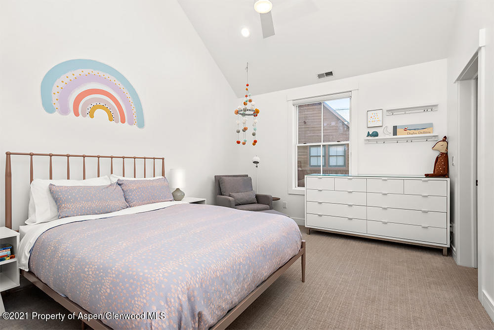 334 Sopris Circle Basalt, CO 81621 - Photo 18 of 34 a bedroom with bed and a window